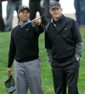Tiger Woods se svým trenérem.