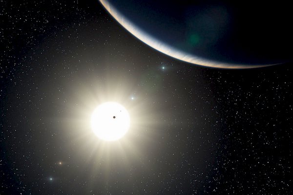 Planetární systém u hvězdy HD 10180 v představách malíře.