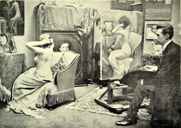 Malíř Bohumil Mareček (1884-1962) maluje nahou ženu ve své pražském ateliéru.