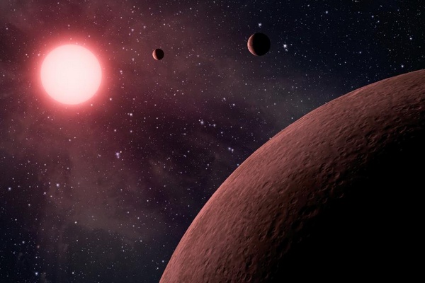 Planetární systém u hvězdy KOI-961 v představách malíře.