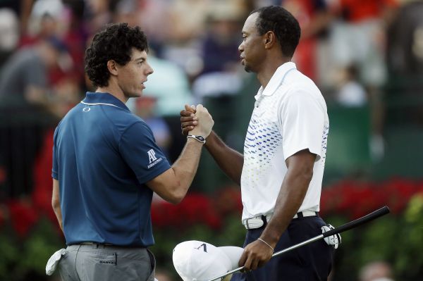 Rory McIlroy a Tiger Woods. Současná a bývalá jednička světového golfu. Rory McIlroy a Tiger Woods. Současná a bývalá jednička světového golfu.