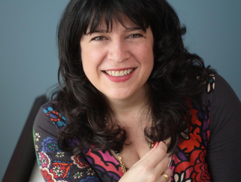 Autorka podepisující se E. L. James.