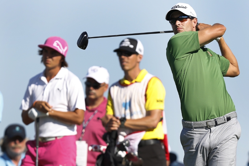 Australský golfista Adam Scott (vpravo). Australský golfista Adam Scott (vpravo).