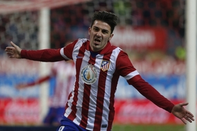 Útočník David Villa.