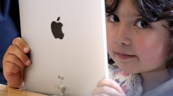 Apple odškodní rodiče, jejichž děti nevědomky utrácely za placený obsah (ilustrační foto). 
