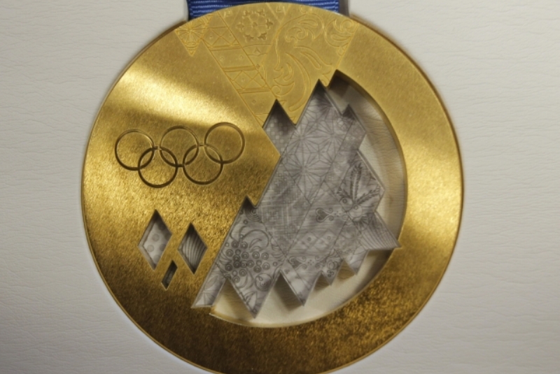 Zlatá olympijská medaile ze Soči.
