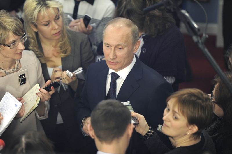 Ruský prezident Vladimir Putin s novináři. 