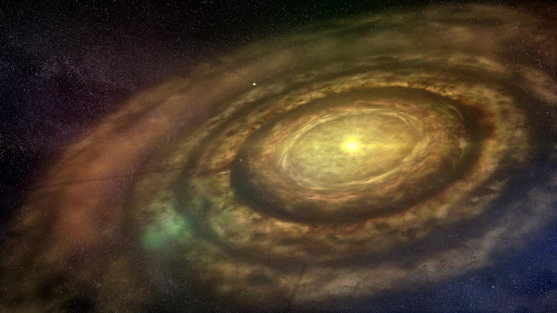 Mladá hvězda obklopená zárodky budoucího planetárního systému podle představ umělce.