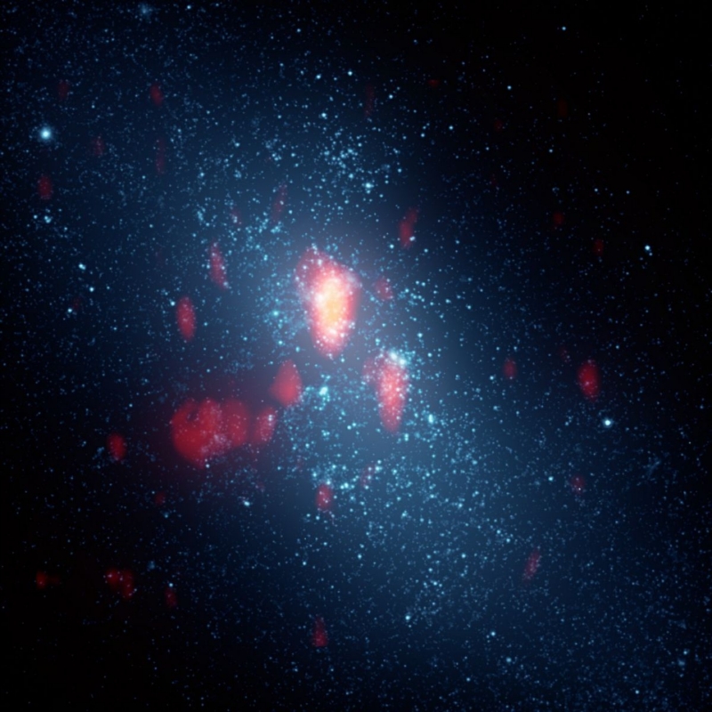 Kombinace obrazů galaxie ve viditelném světle a v oblasti radiového záření. Žlutá a červená barva znamená mezihvězdný plyn. Bílé kuličky jsou hvězdné shluky. Nejjasnější část obrázku je mrak D.