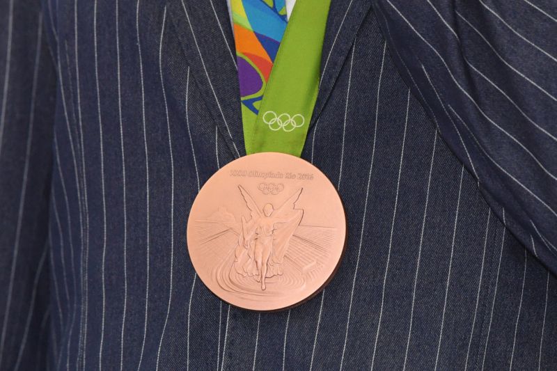 Olympijská medaile - znamení sportovního úspěchu.