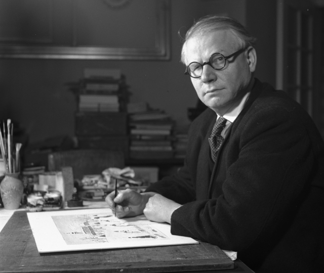 Malíř Josef Lada při práci ve své bytě na snímku z roku 1947.