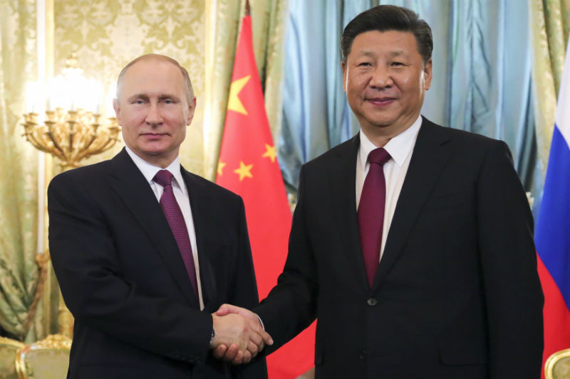 Zleva: Vladimir Putin a Si Ťin-pching.