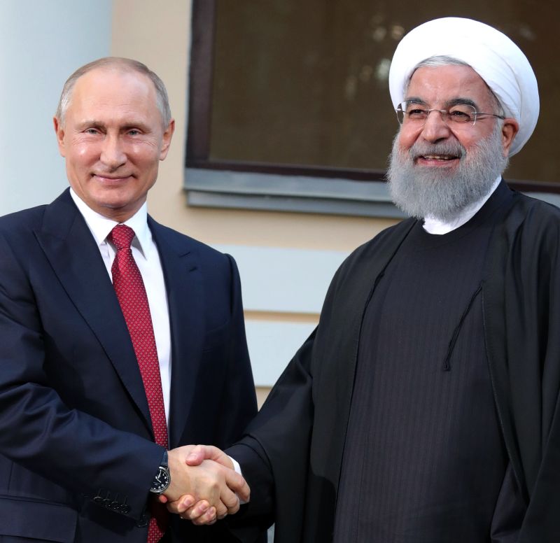 Íránský prezident Hasan Rúhání (vpravo) a jeho ruský protějšek Vladimir Putin.