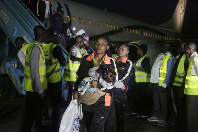 Migranti z Libye.