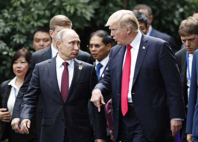 Vladimir Putin (vlevo) a Donald Trump.