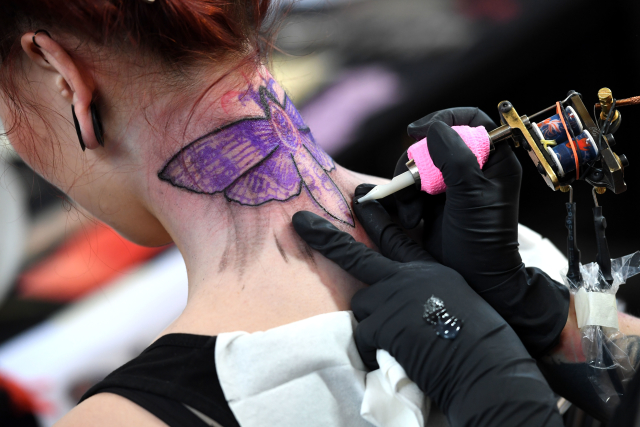 Fotografie z loňského ročníku Tattoo Convention. 