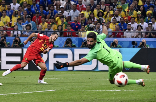 Brazilský reprezentační brankář Alisson Becker . 