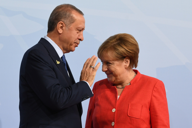 Turecký prezident Recep Tayyip Erdogan a německá kancléřka A. Merkelová.