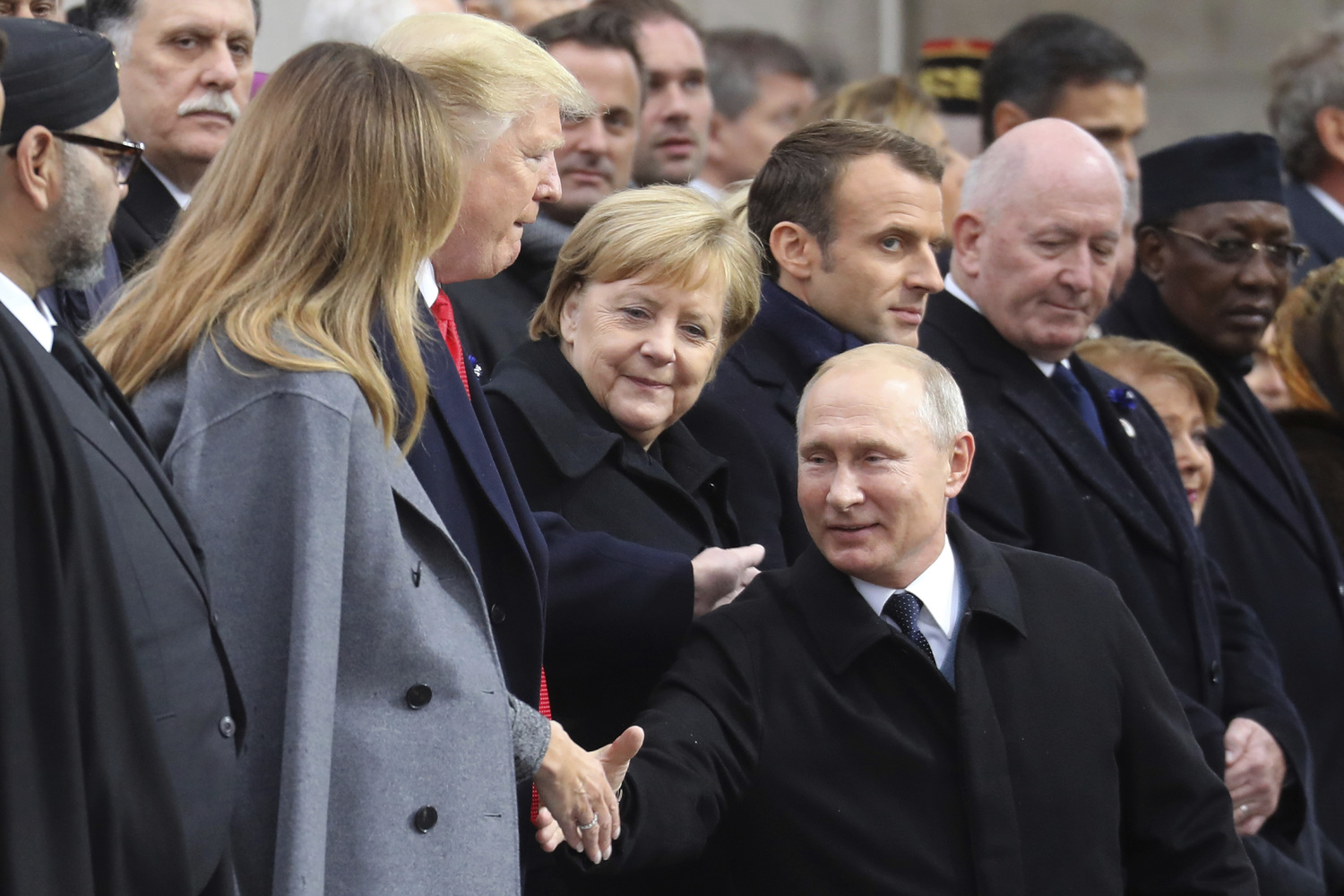 Vladimír Putin, Angela Merkelová  a další státníci.