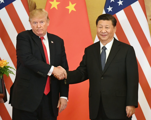 Donald Trump (vlevo) a Si Ťin-pching. Donald Trump (vlevo) a Si Ťin-pching.