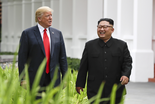 Prezident Donald Trump a vůdce Kim Čong-un.