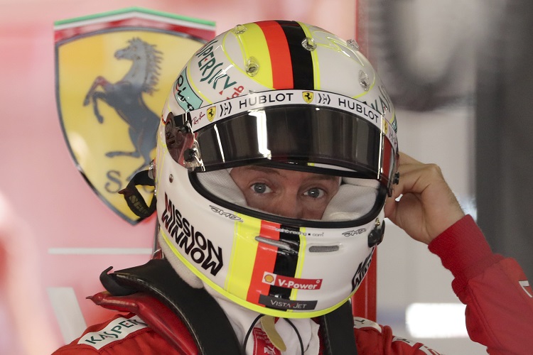 Sebastian Vettel, jezdec z týmu Ferrari. Sebastian Vettel, jezdec z týmu Ferrari.
