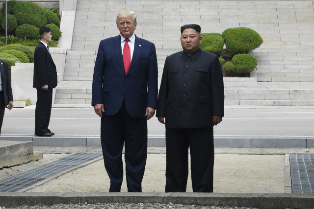 Americký prezident Donald Trump a severokorejský vůdce Kim Čong-Un.