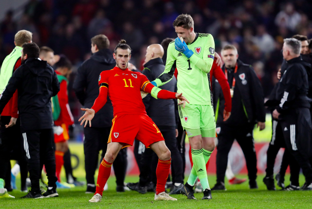 Gareth Bale (s číslem 11) po postupovém zápase.