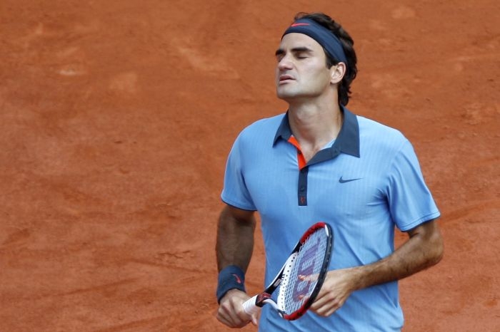 Roger Federer v utkání proti Tommy Haasovi.