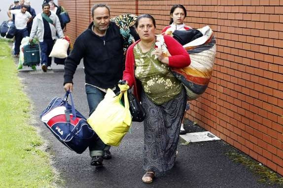 Balkánští Romové se v Belfastu stěhují po útocích.