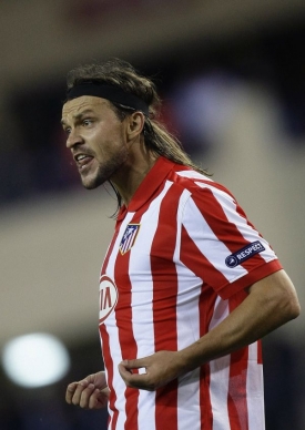 Fotbalov&yacute; obr&aacute;nce Tom&aacute;&scaron; Ujfalu&scaron;i v dresu Atl&eacute;tica Madrid.