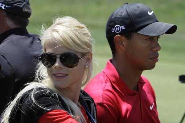 Tiger Woods s manželkou. 