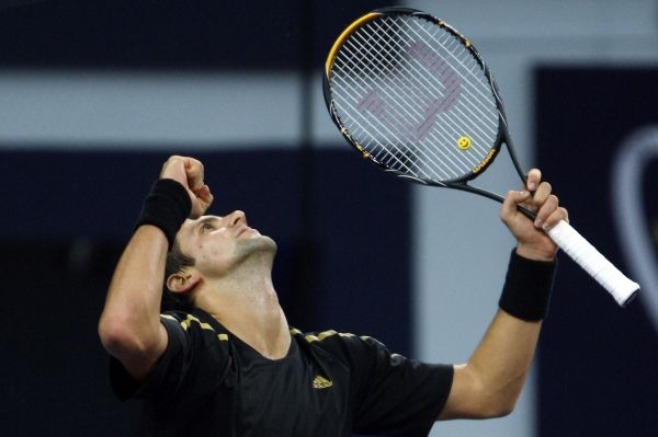Srbský tenista Novak Djokovič se raduje z výhry na Turnaji mistrů.